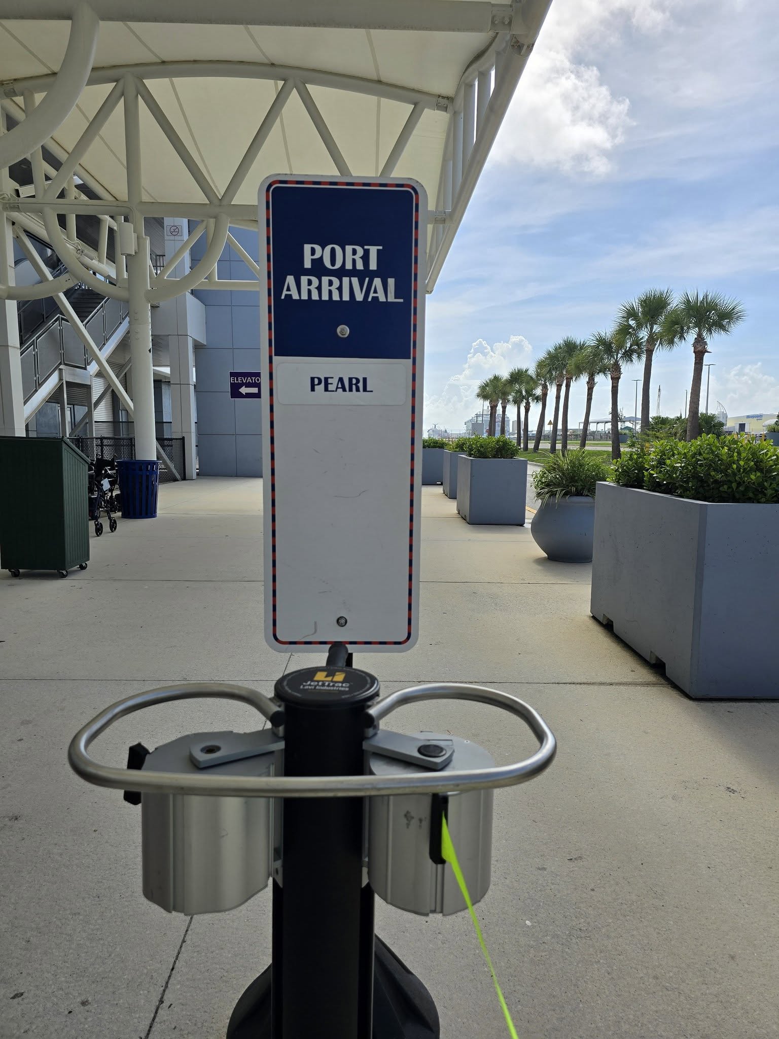 The Pearl port arrival sign at the terminal