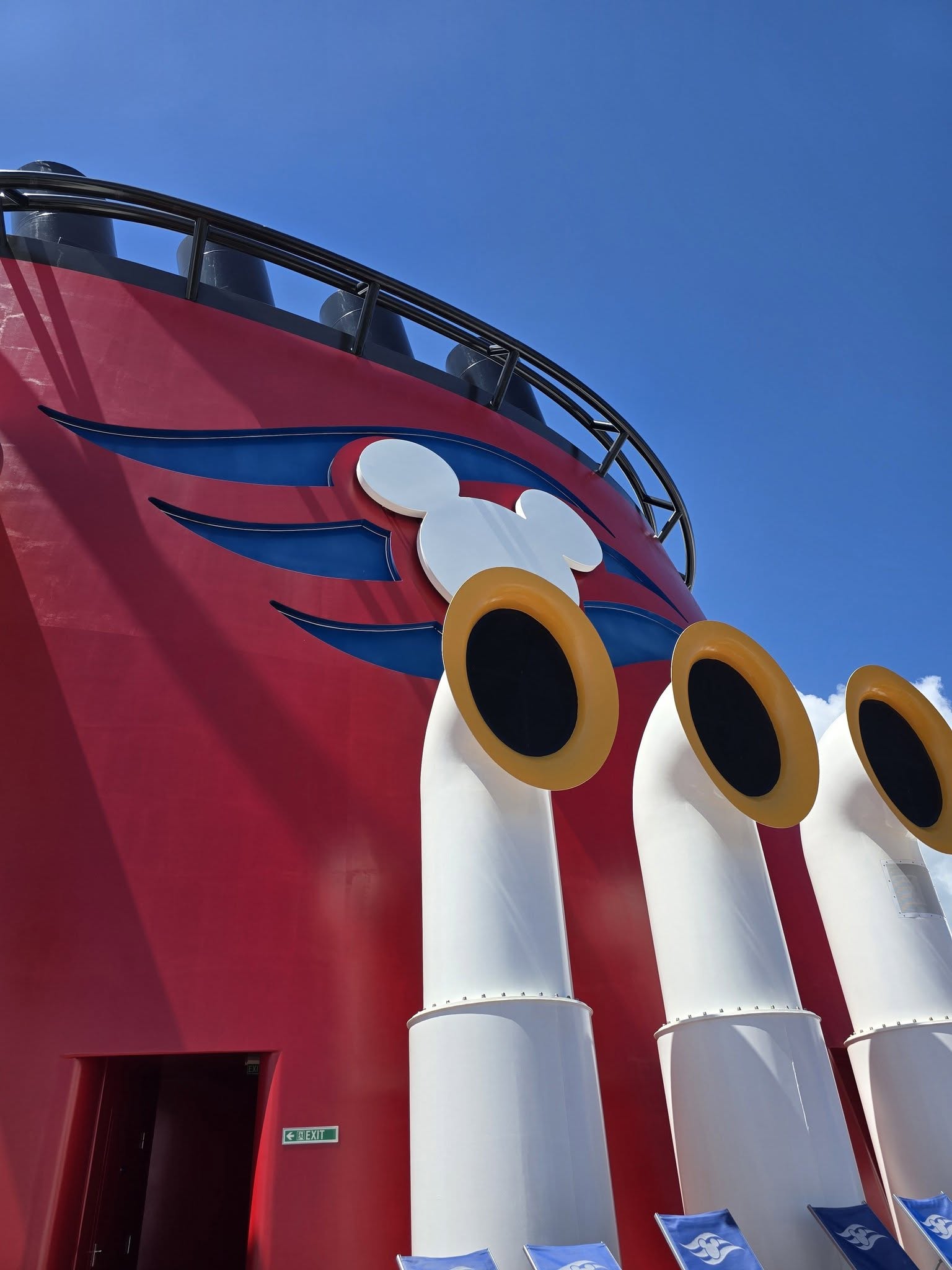 Kathy's view from her deck chair in Nassau: the Wish's red funnels