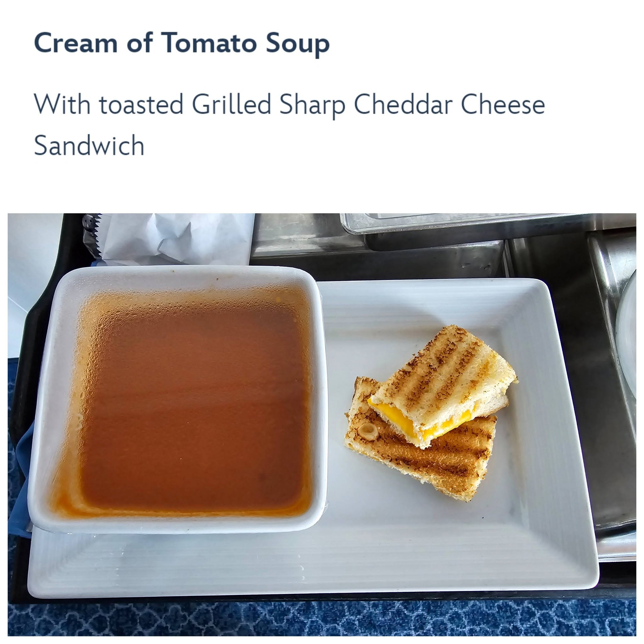 Room service and a movie: cream of tomato soup and grilled cheese