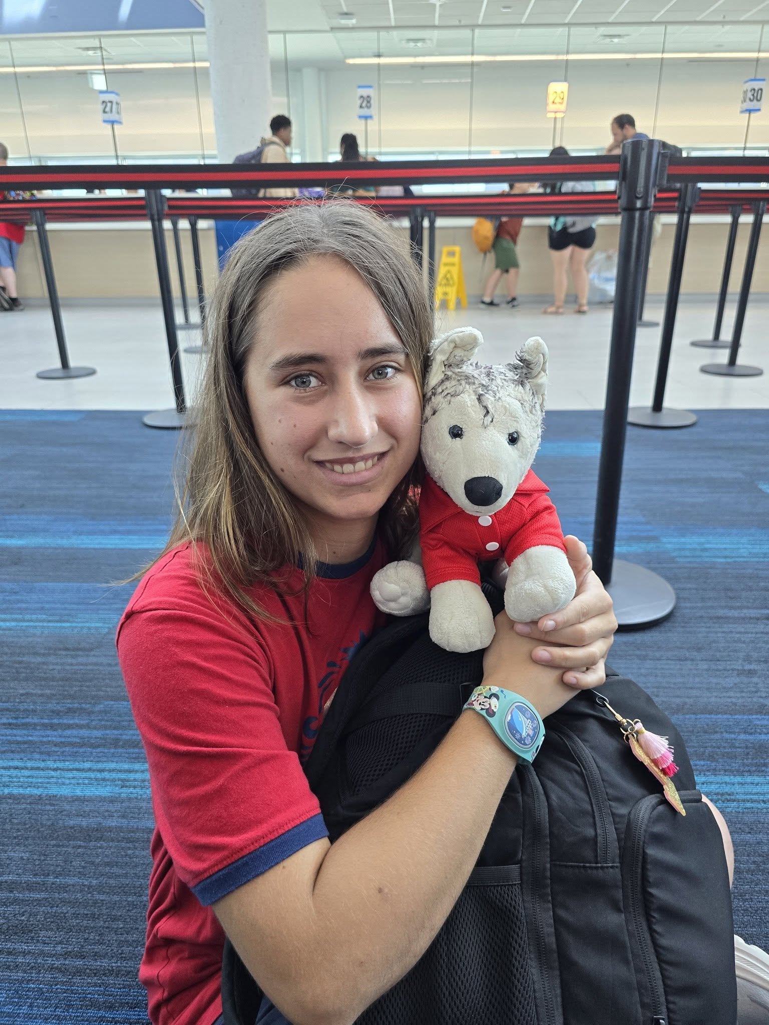 Lisa and Bob the dog in matching red at the port