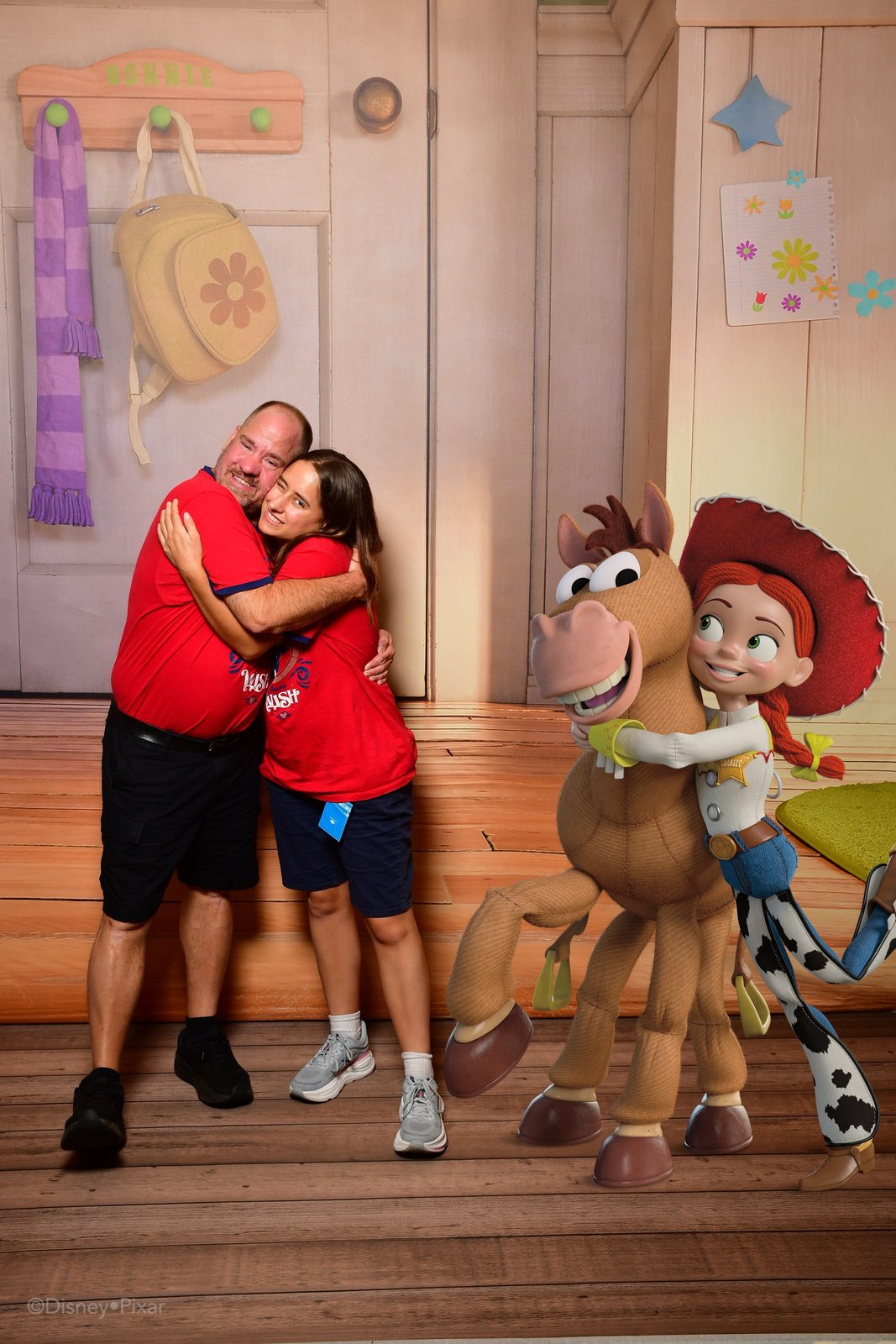 Lisa and Michael hugging at the Toy Story backdrop