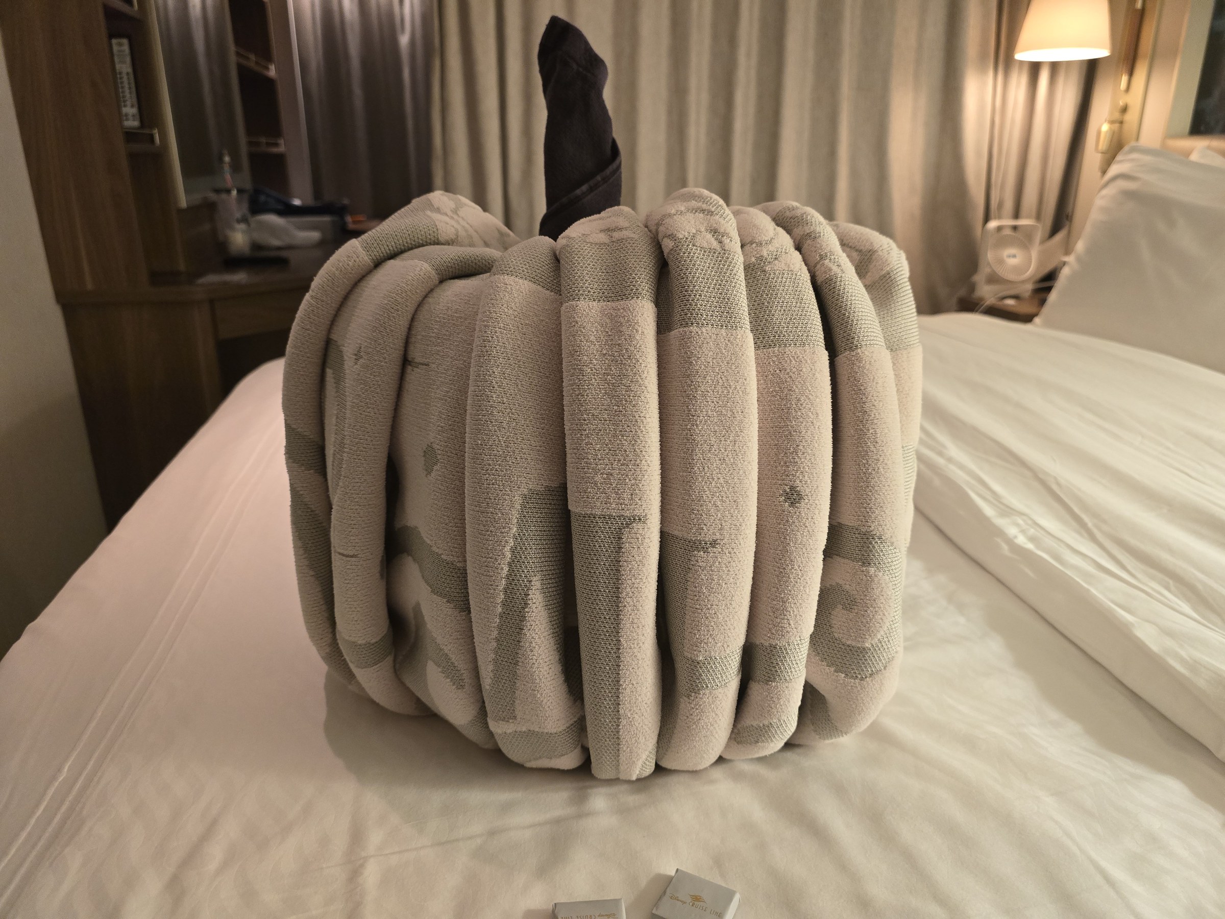 The towel pumpkin waiting on the bed