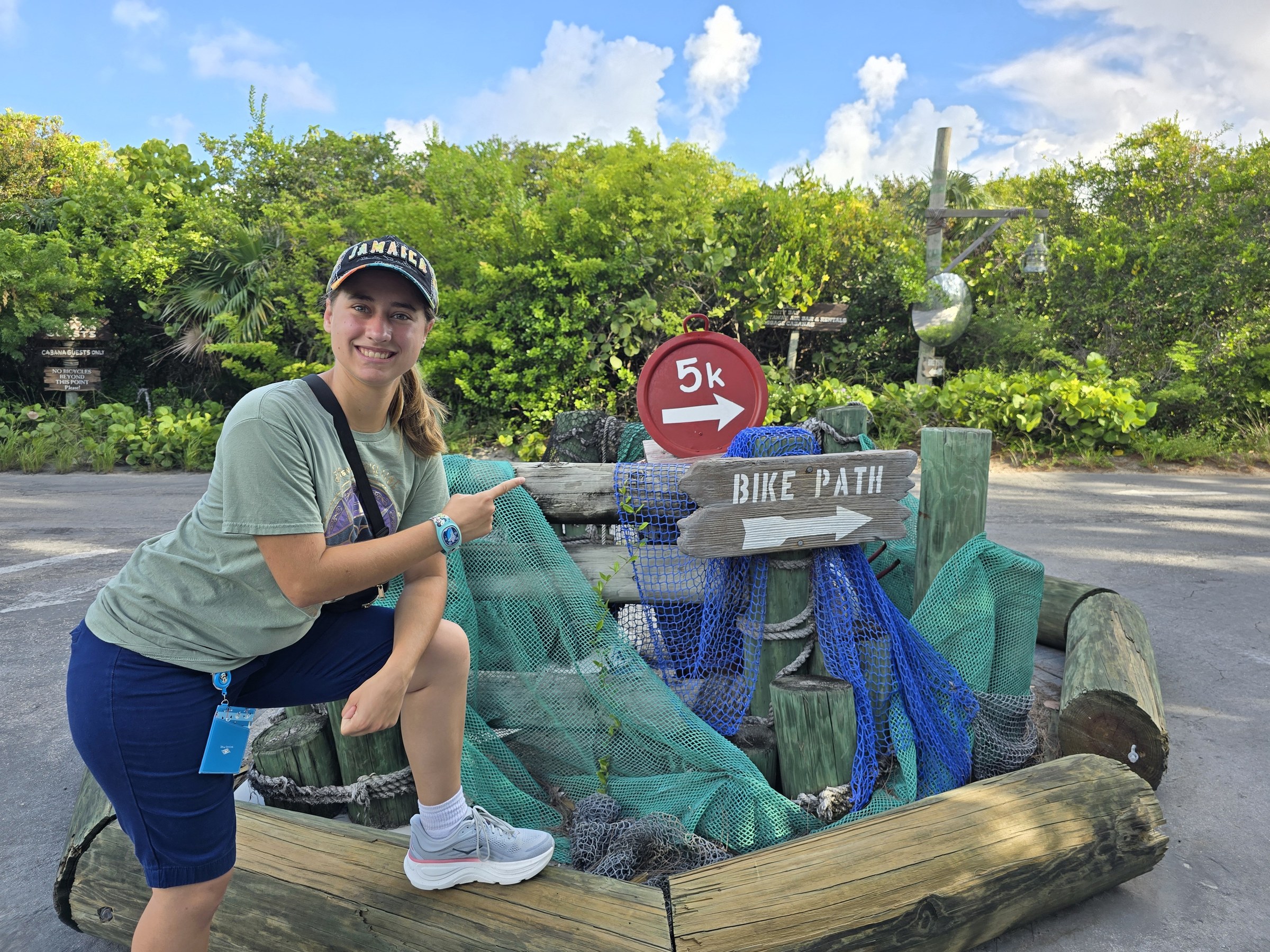 Lisa at the 5K sign on Castaway Cay