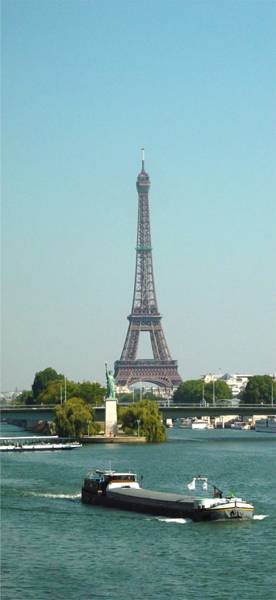 The Eiffel Tower behind the Statue of Liberty replica