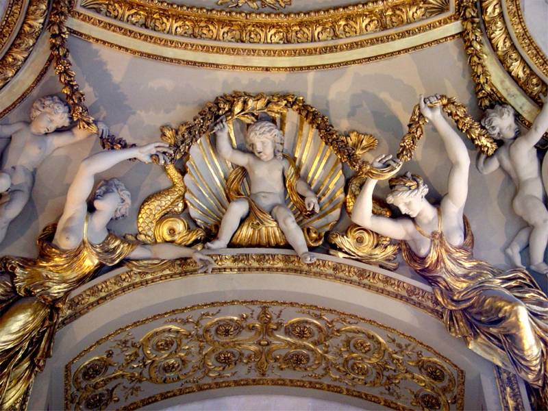 Gilded ceiling cherubs above us at the Louvre
