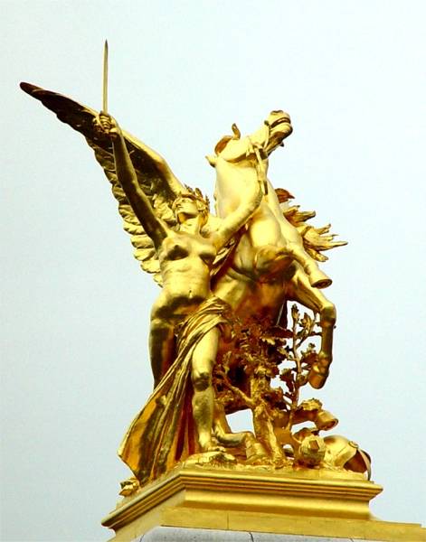 A golden statue near the Arc de Triomphe