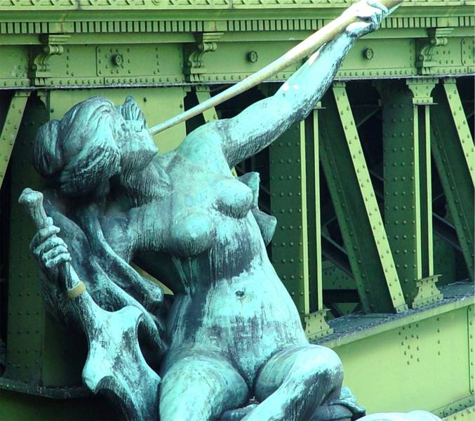 A bronze statue on a Paris bridge