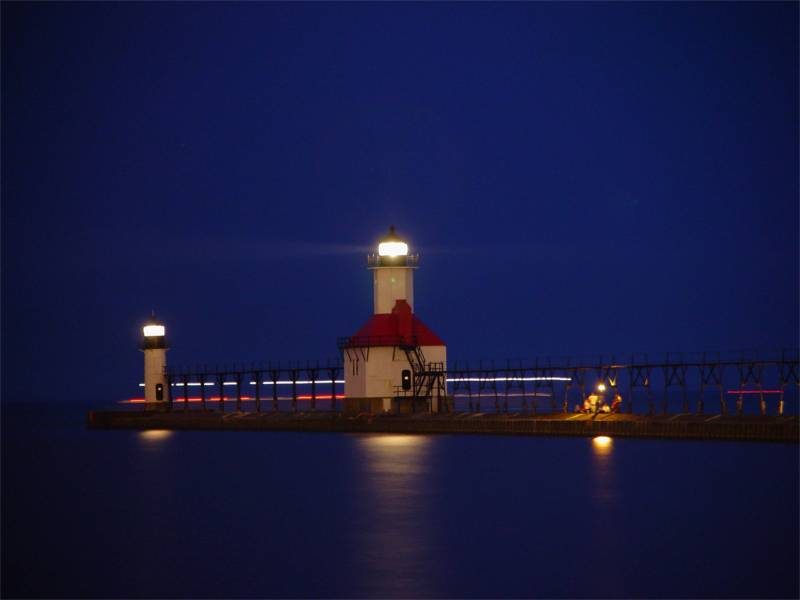 The St. Joseph lighthouses lit up at dusk