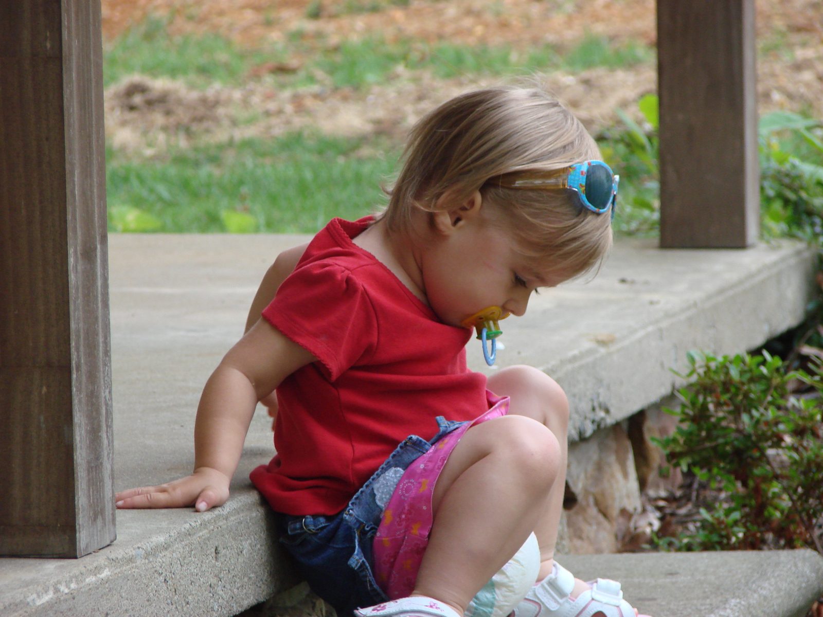 Lisa sitting on the porch step
