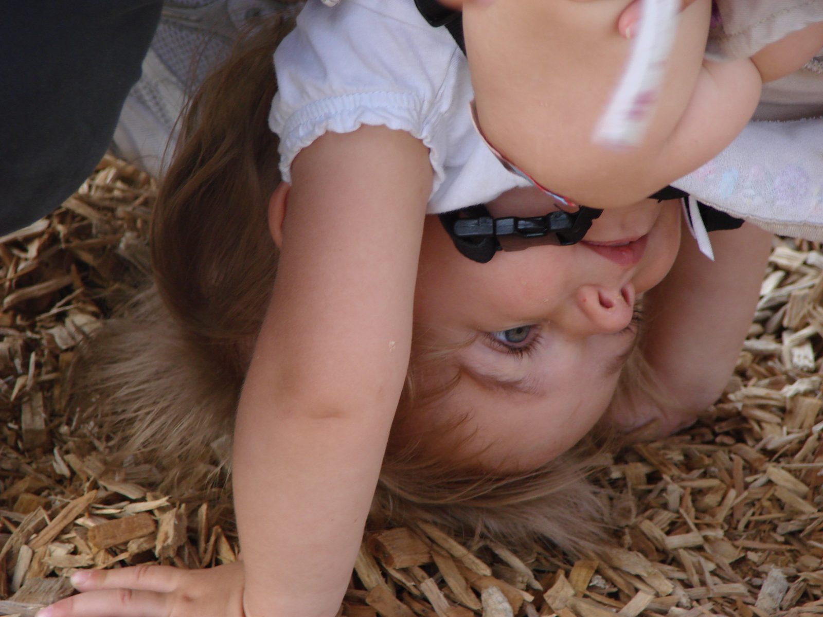 Being flipped upside down at the playground