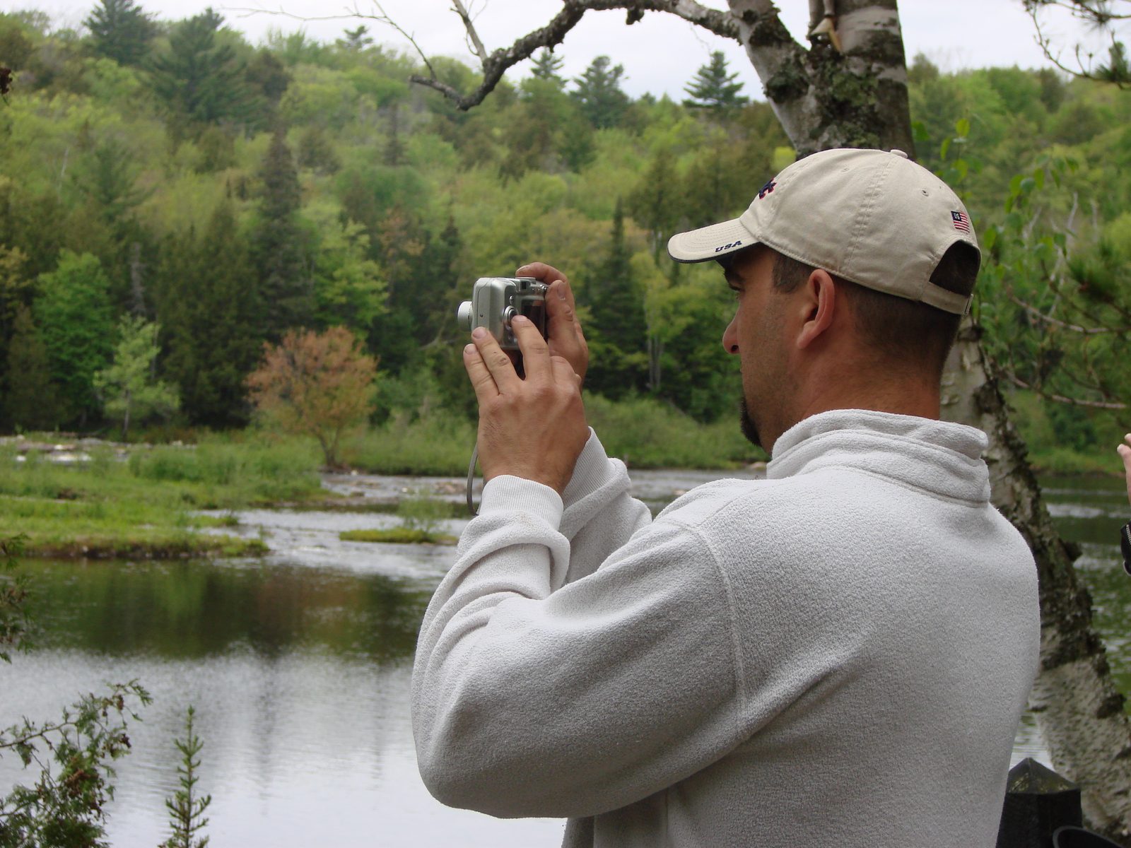 Taking pictures by the pond