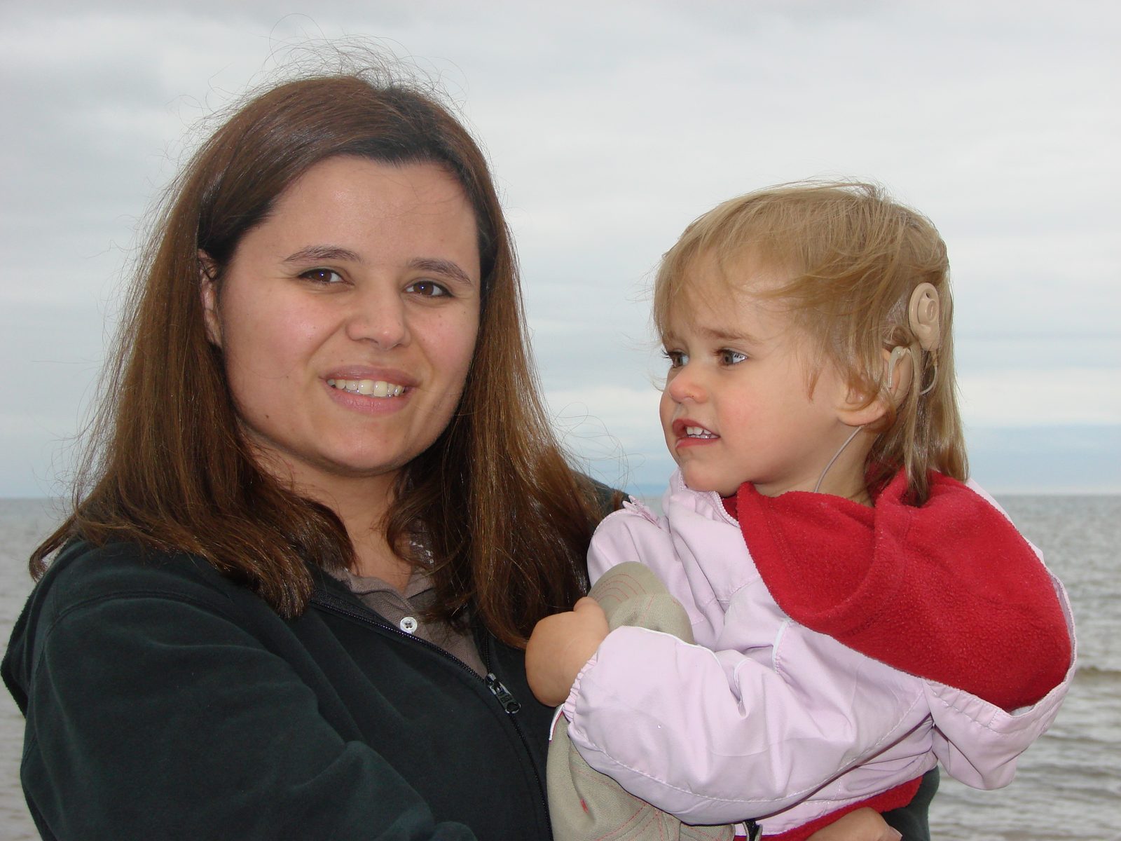 Kathy holding Lisa by Lake Superior
