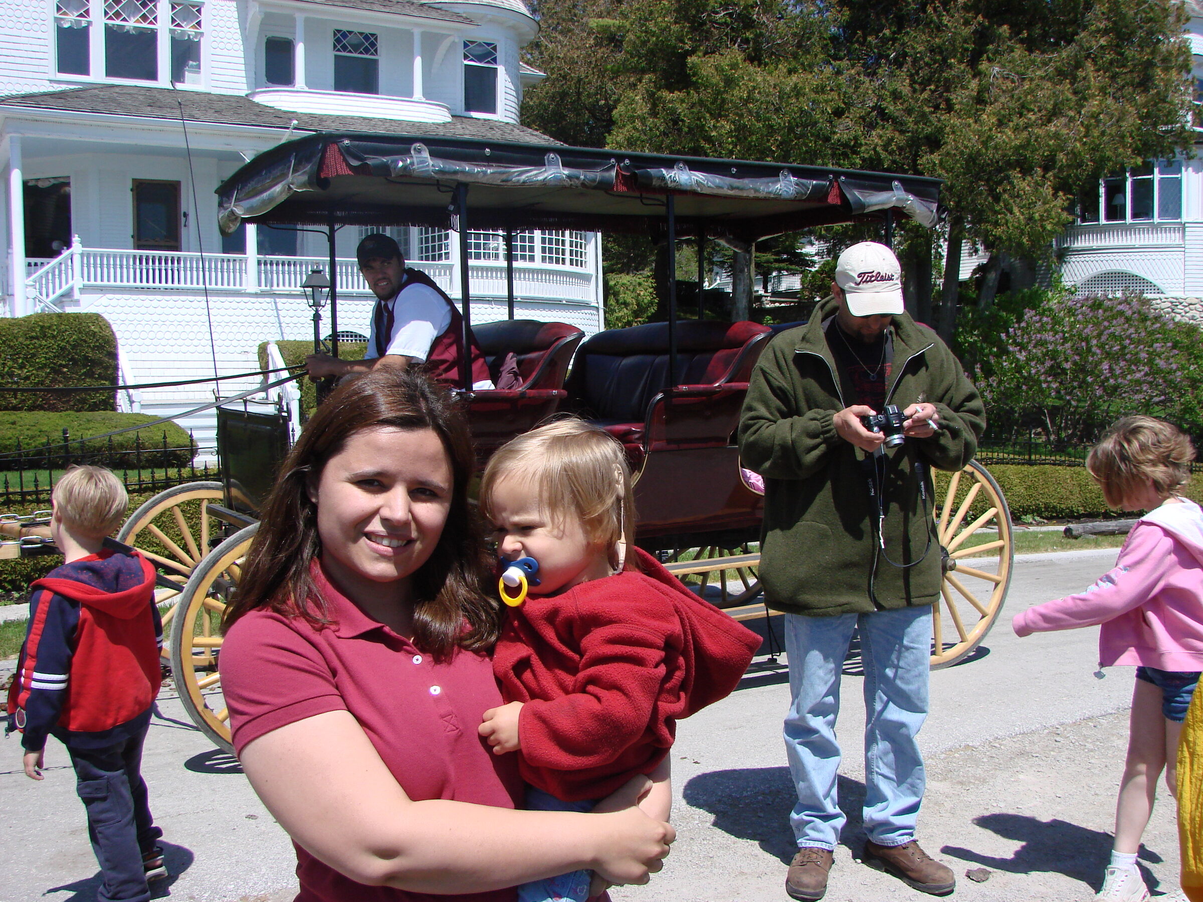 Kathy holds Lisa by the carriage