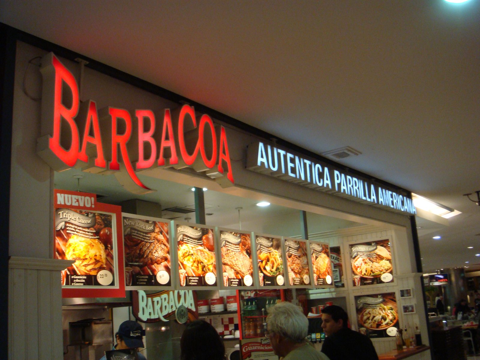 The Barbacoa sign lit up downtown