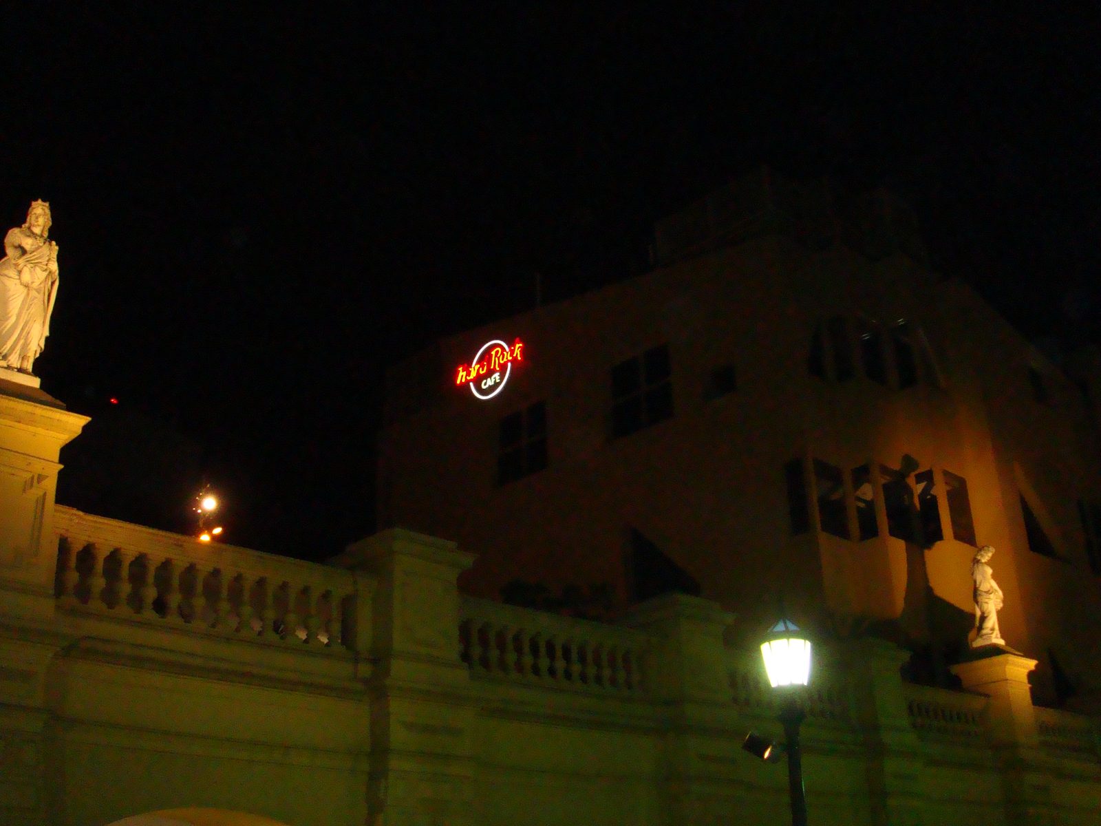 The Hard Rock Cafe sign lit up after dark