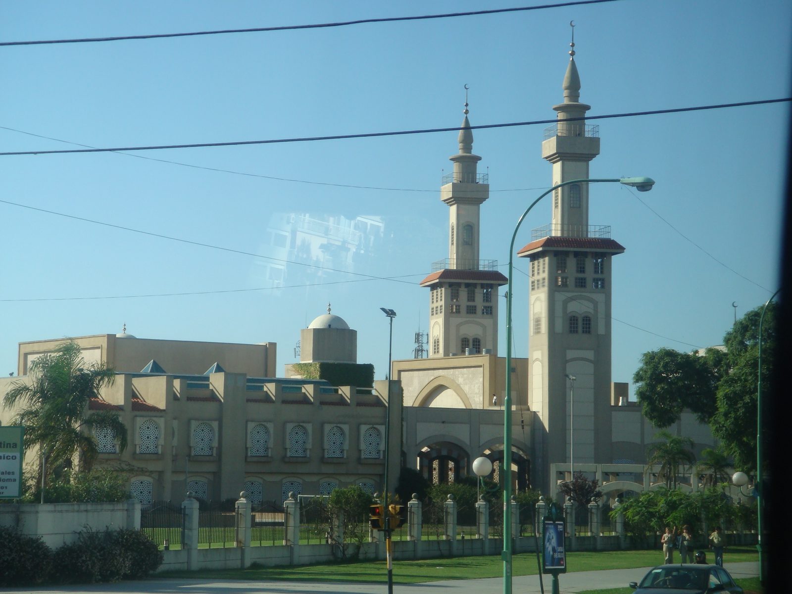 A mosque with its minarets glimpsed from the bus