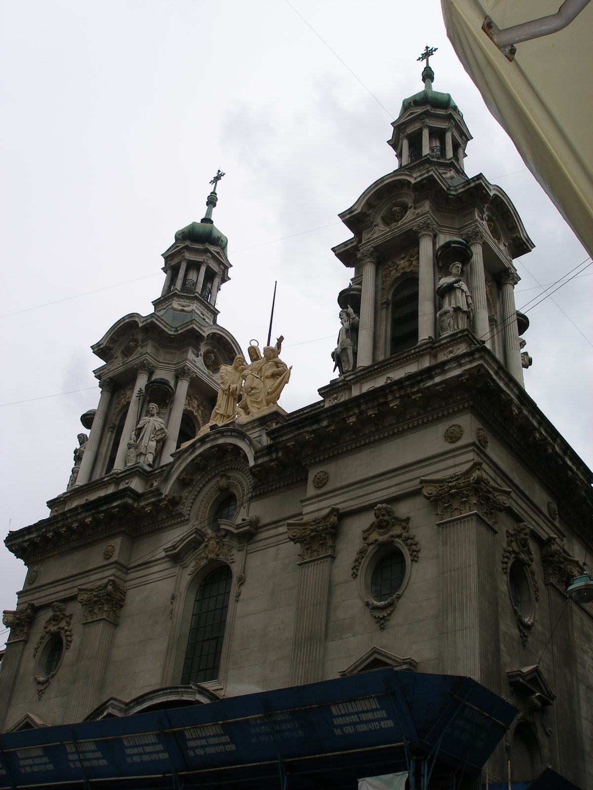 A church tower rising over Plaza de Mayo
