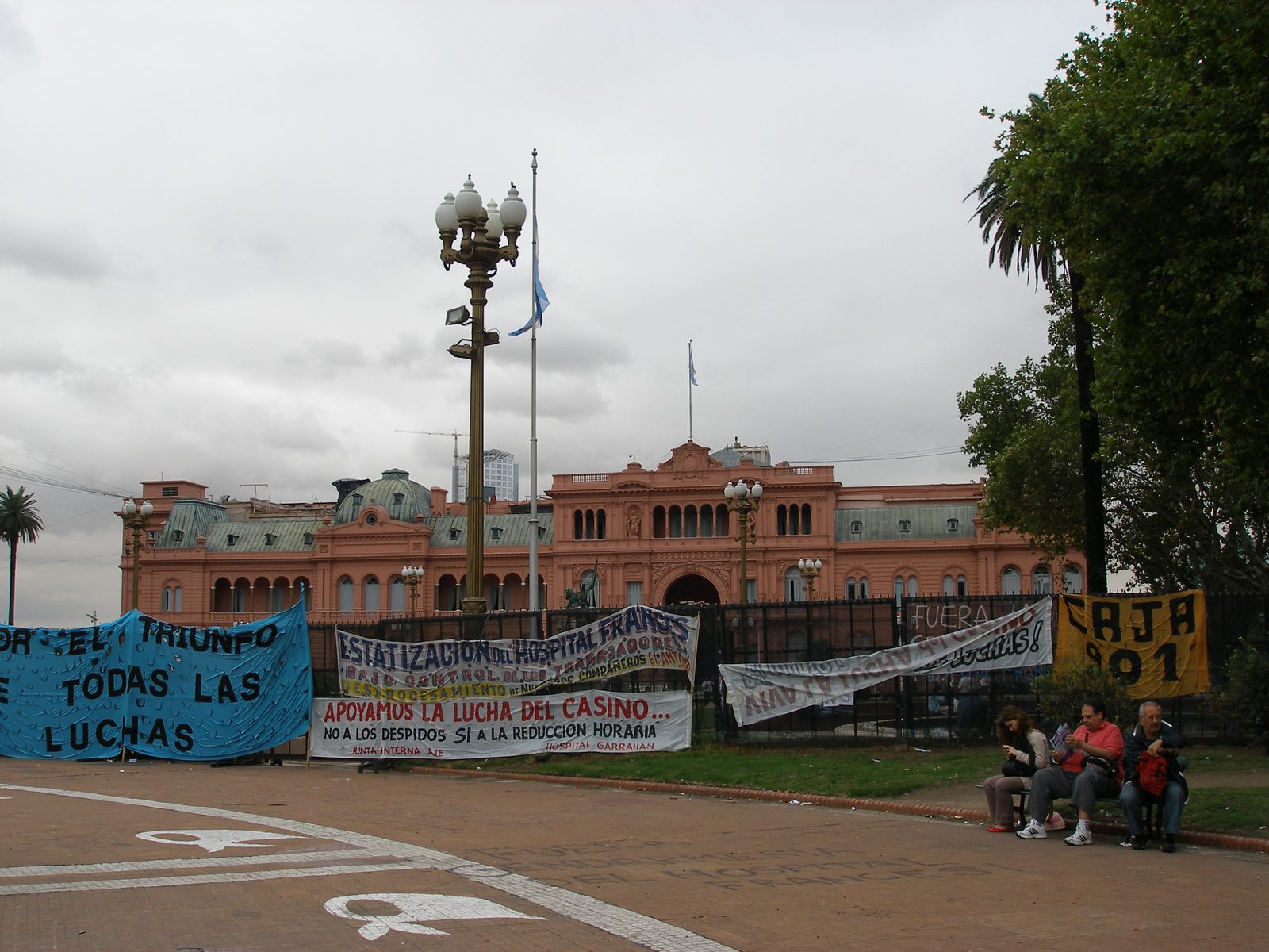 Casa Rosada, with a demonstration's banners along the square