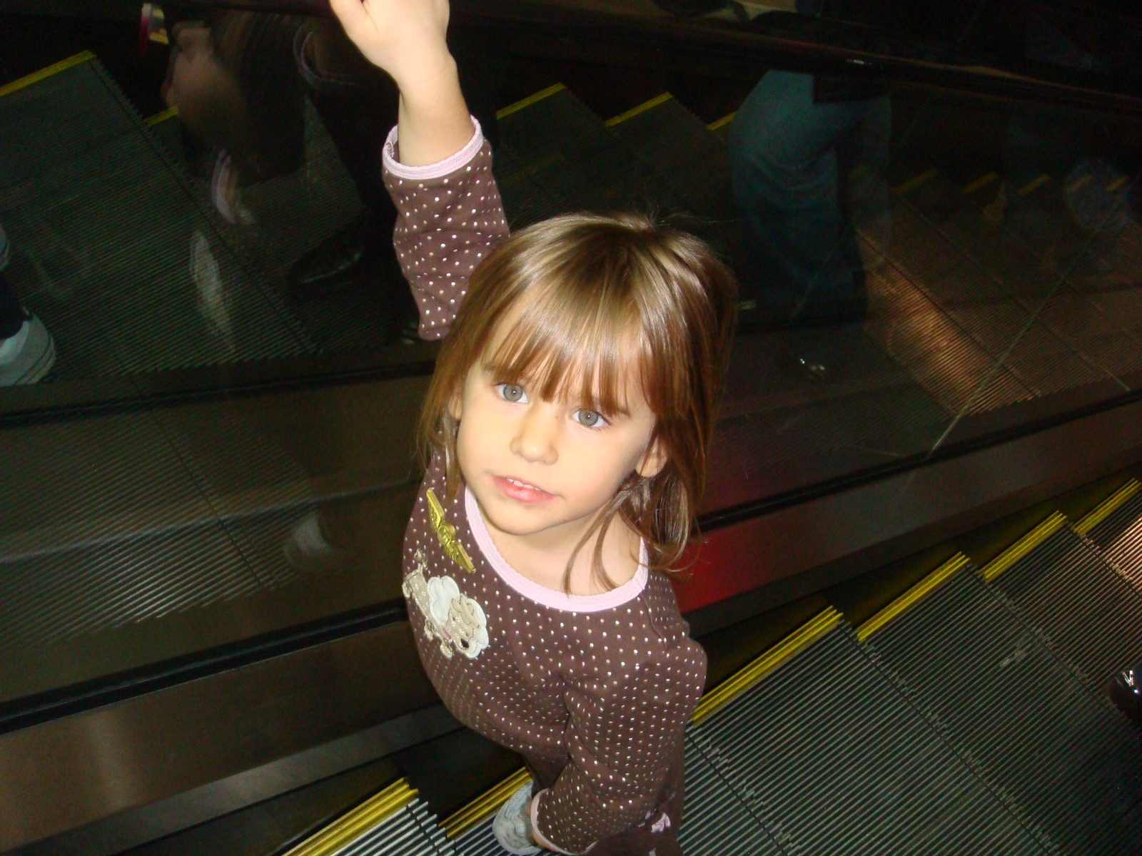 Lisa riding the escalator