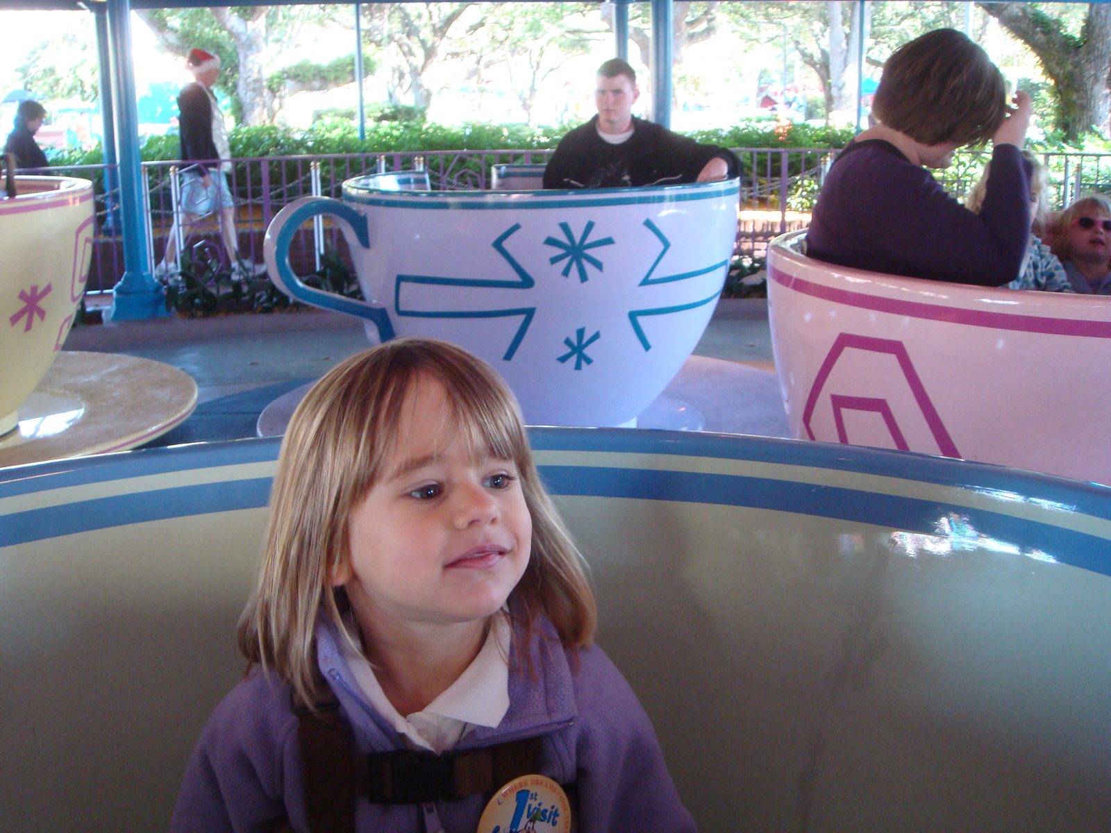 Lisa riding the teacups
