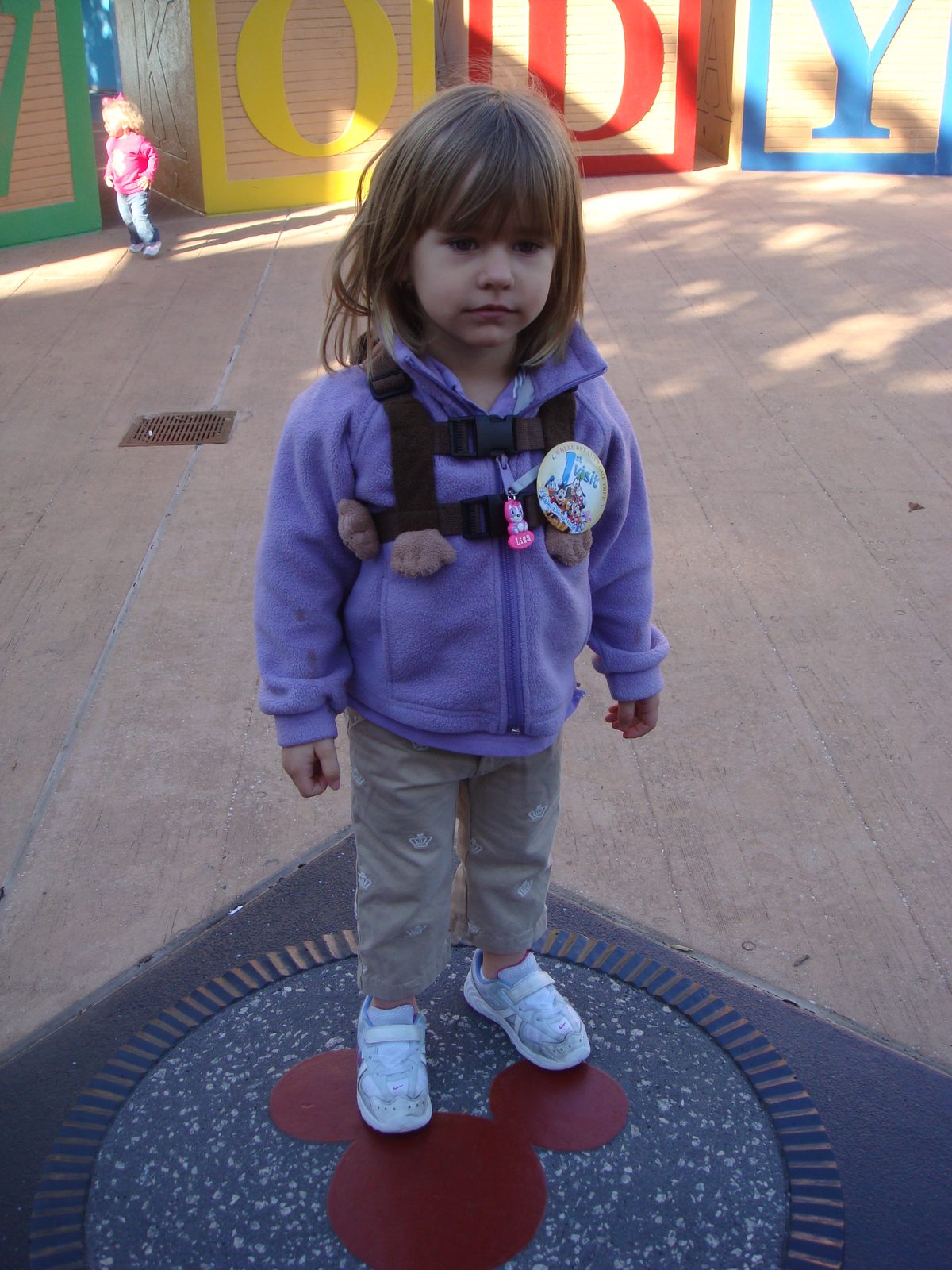 Lisa under the giant Toy Story blocks