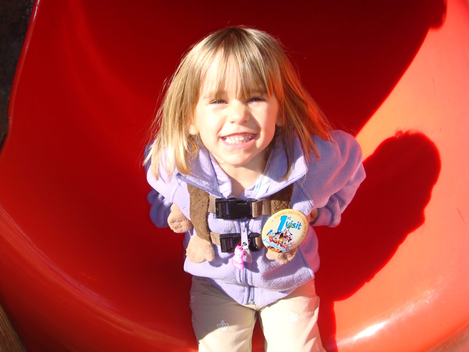 Lisa sliding down at the playground