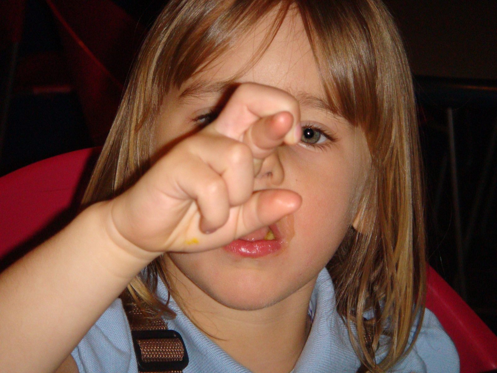 Lisa peeking through her fingers on the ride