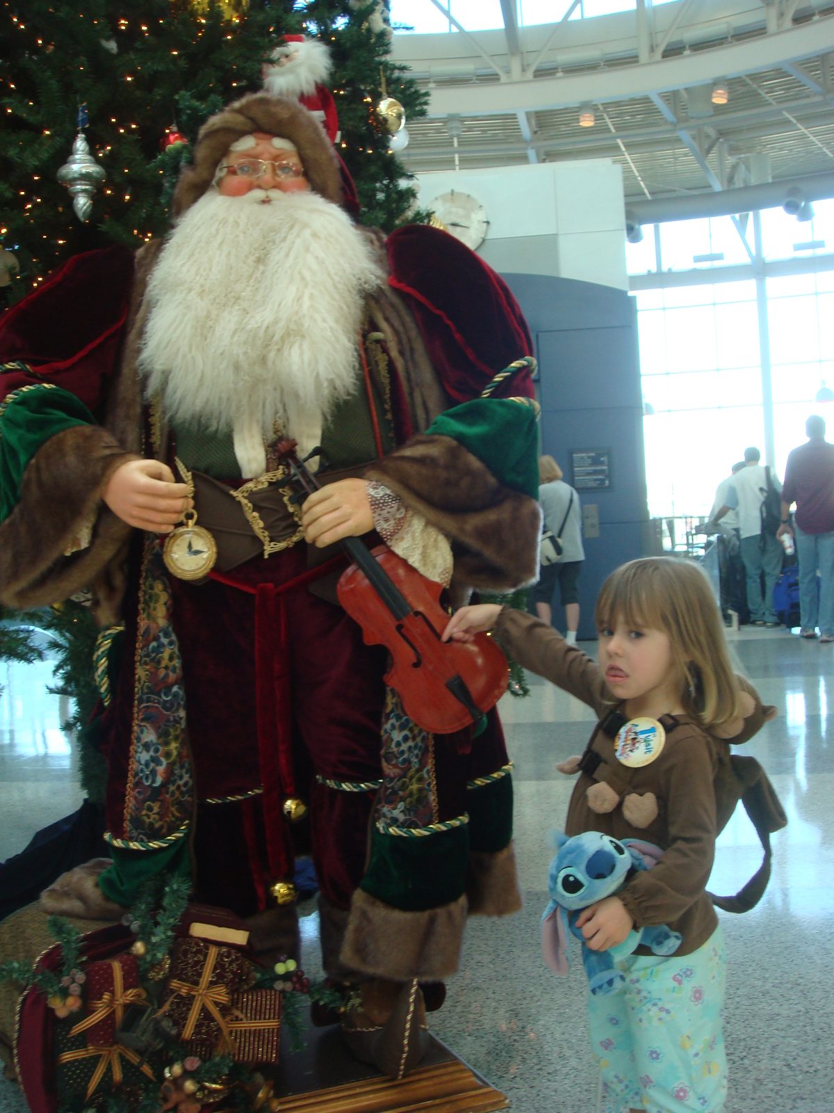 Lisa by the Santa display near our gate