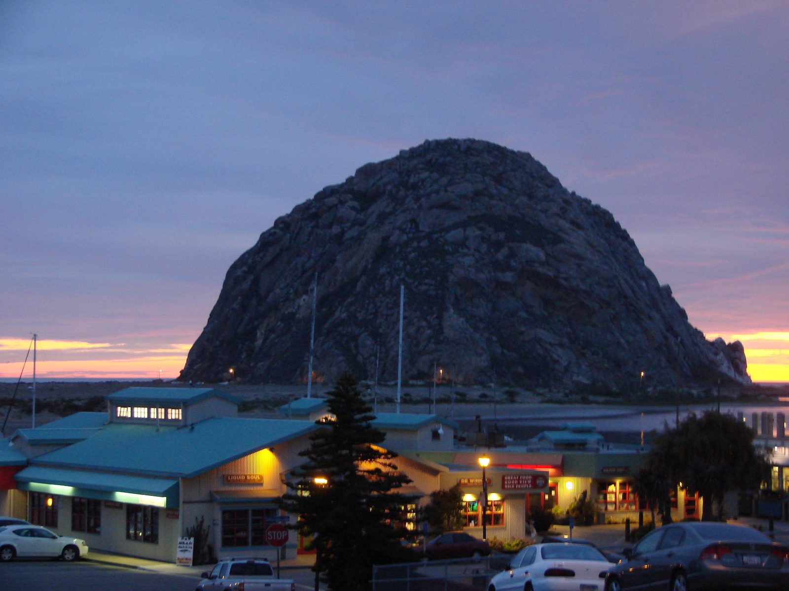 Morro Rock at dusk over the harbor