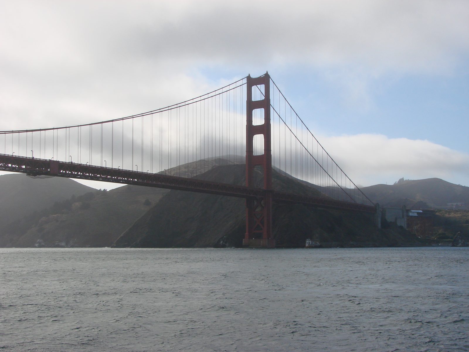 The Golden Gate Bridge standing in its own fog