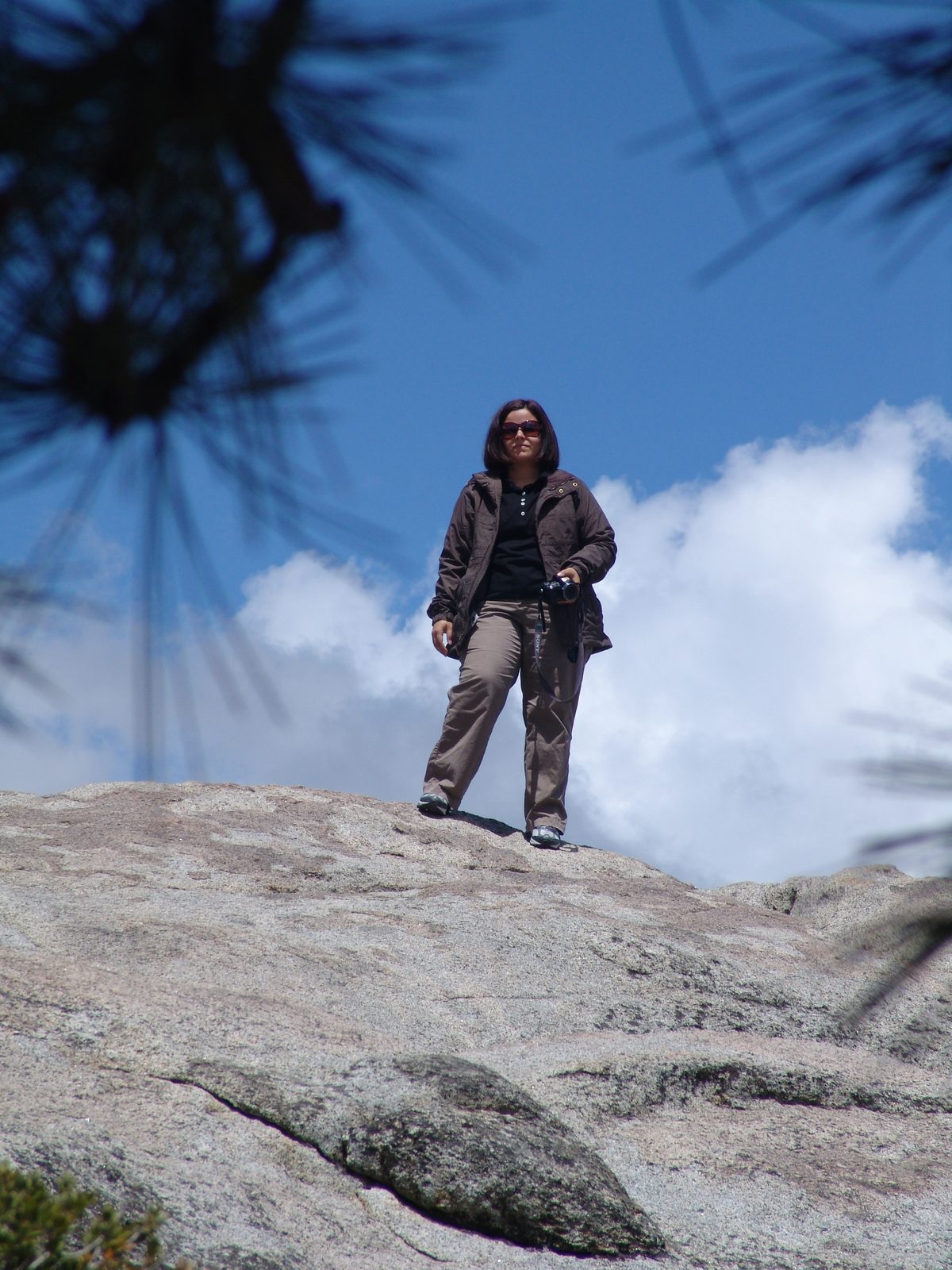 Kathy standing on top of the world at Glacier Point