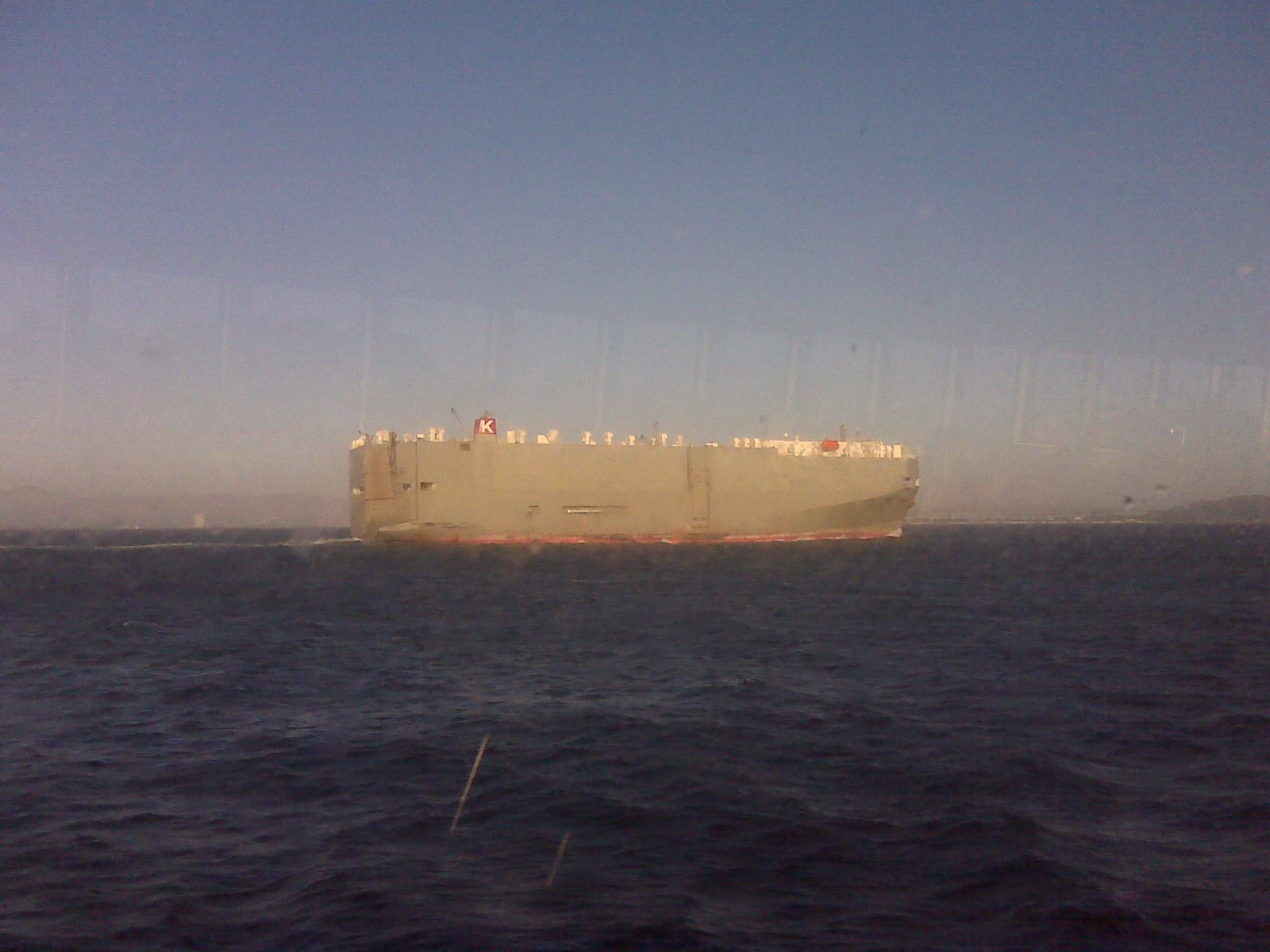 A ship passing at dusk