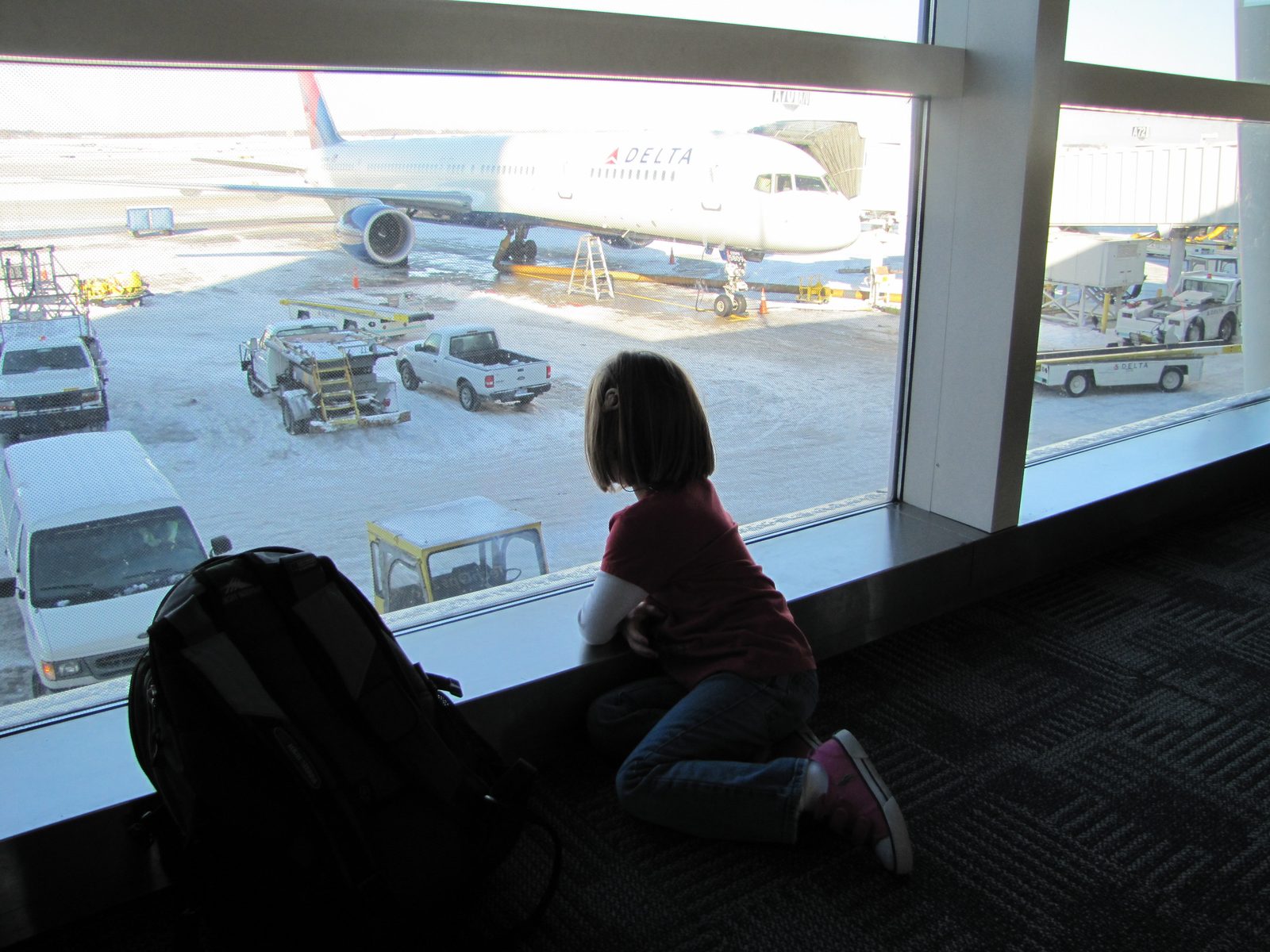 Lisa watching our plane after we landed in Orlando