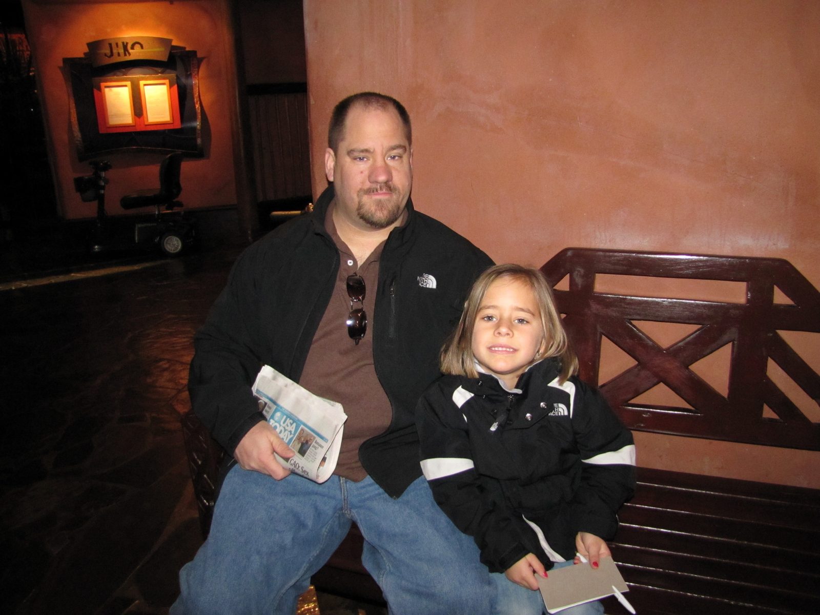 Lisa and Michael waiting for the bus to the Magic Kingdom