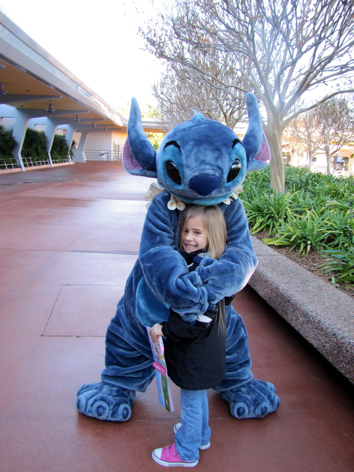 Lisa getting a big hug from Stitch at Epcot