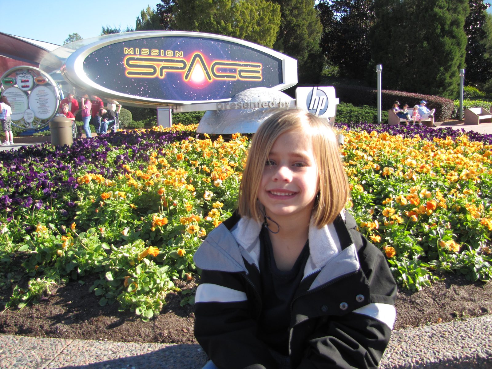 Lisa by the Mission: Space sign at Epcot