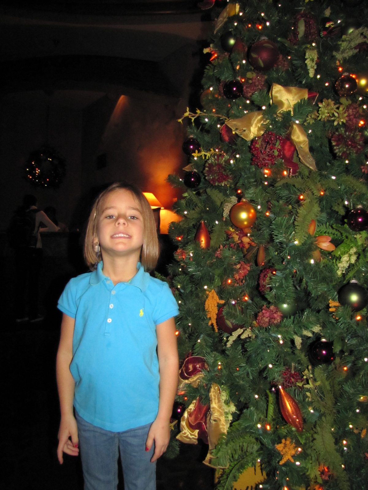 Lisa by the Christmas tree at the lodge restaurant