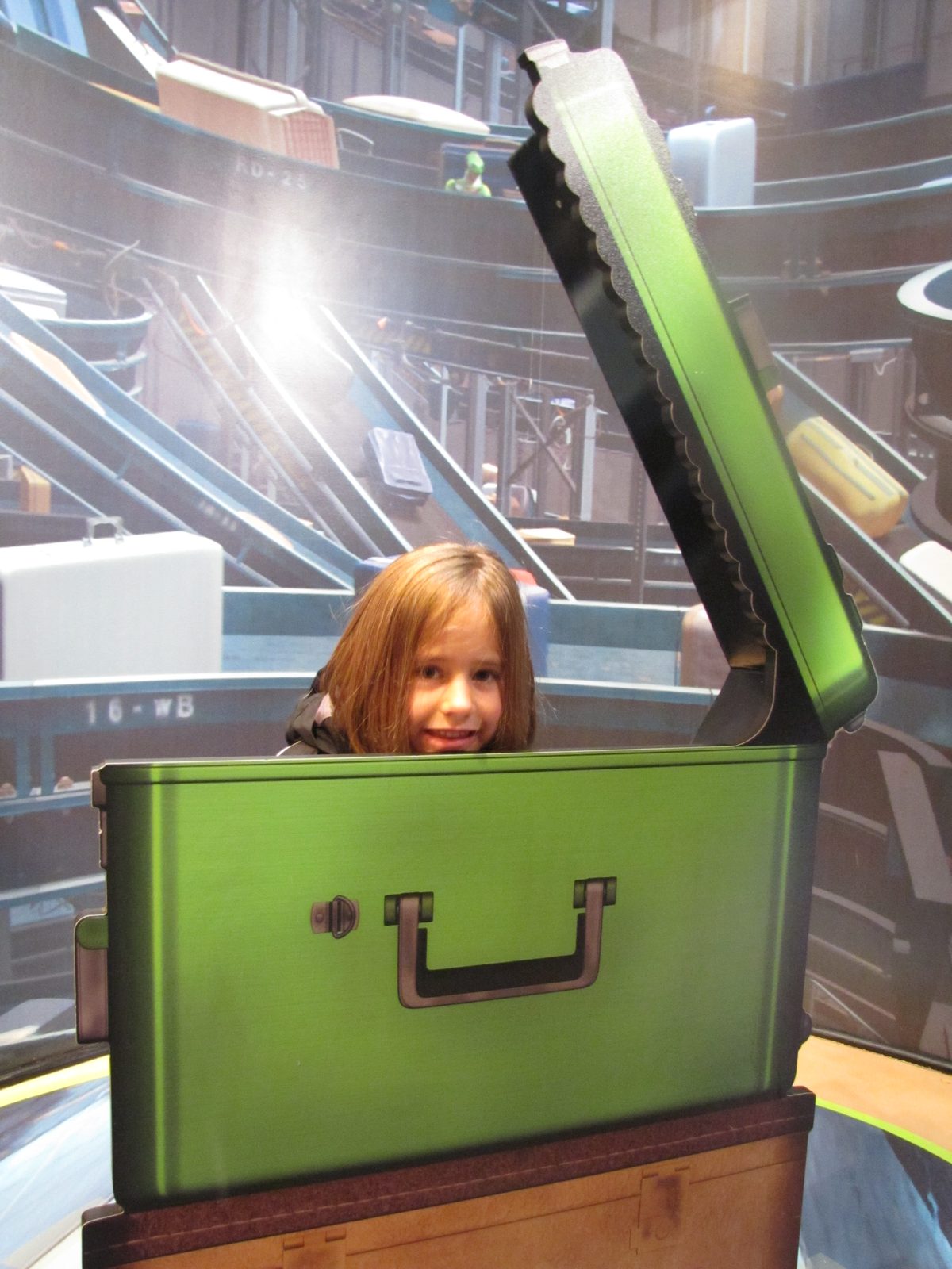 Lisa peeking out of the big toolbox, waiting some more