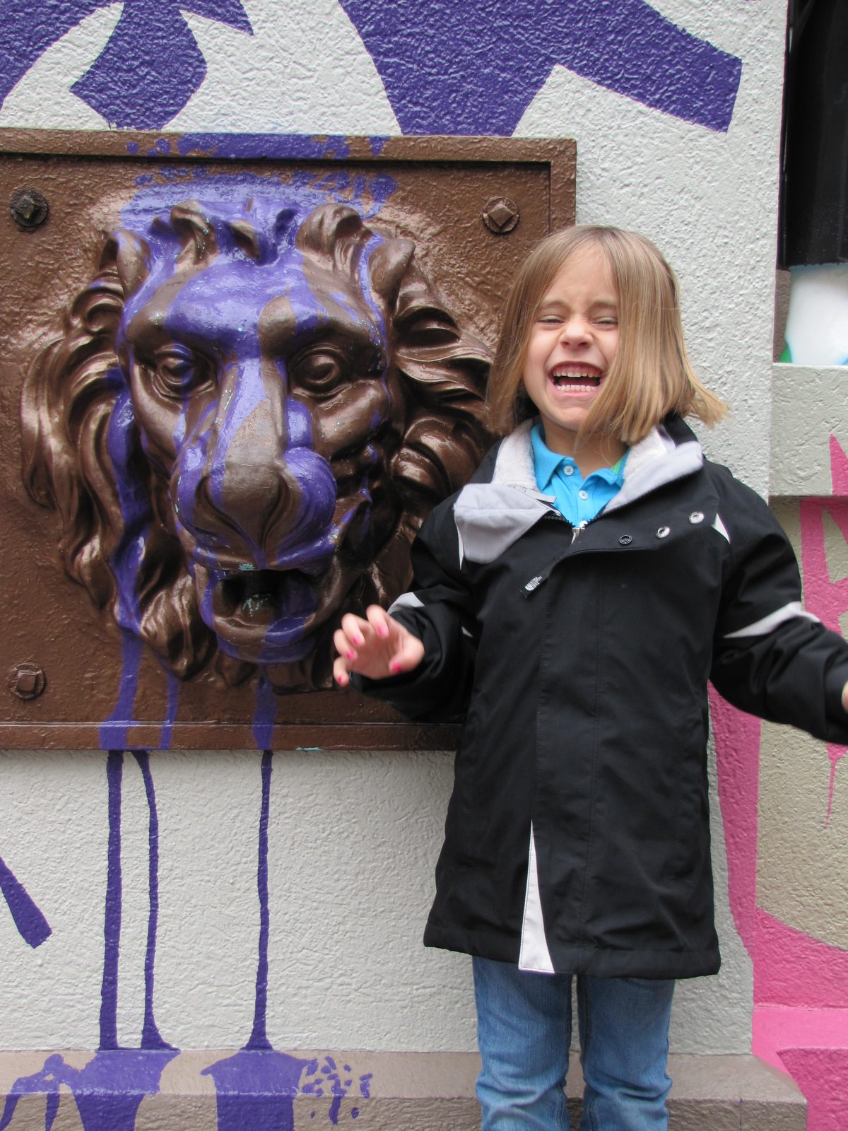 Lisa by the lion head outside the Muppets 3D show