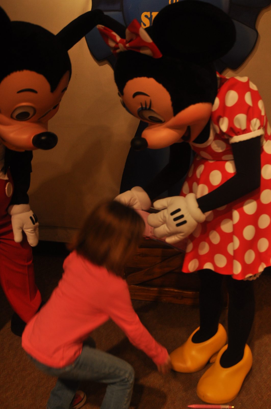 Lisa hugs Mickey and Minnie