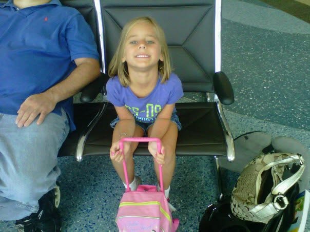 Lisa excited at the Kalamazoo airport before our flight