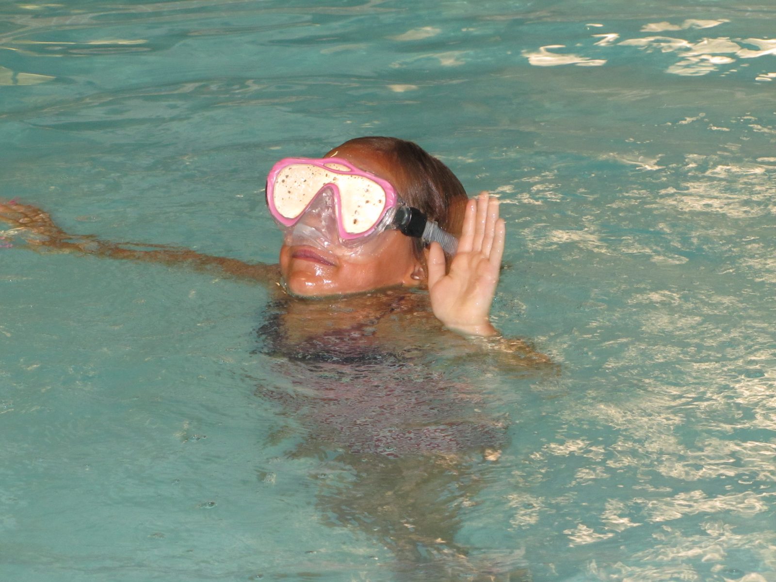Lisa swimming with her goggles on