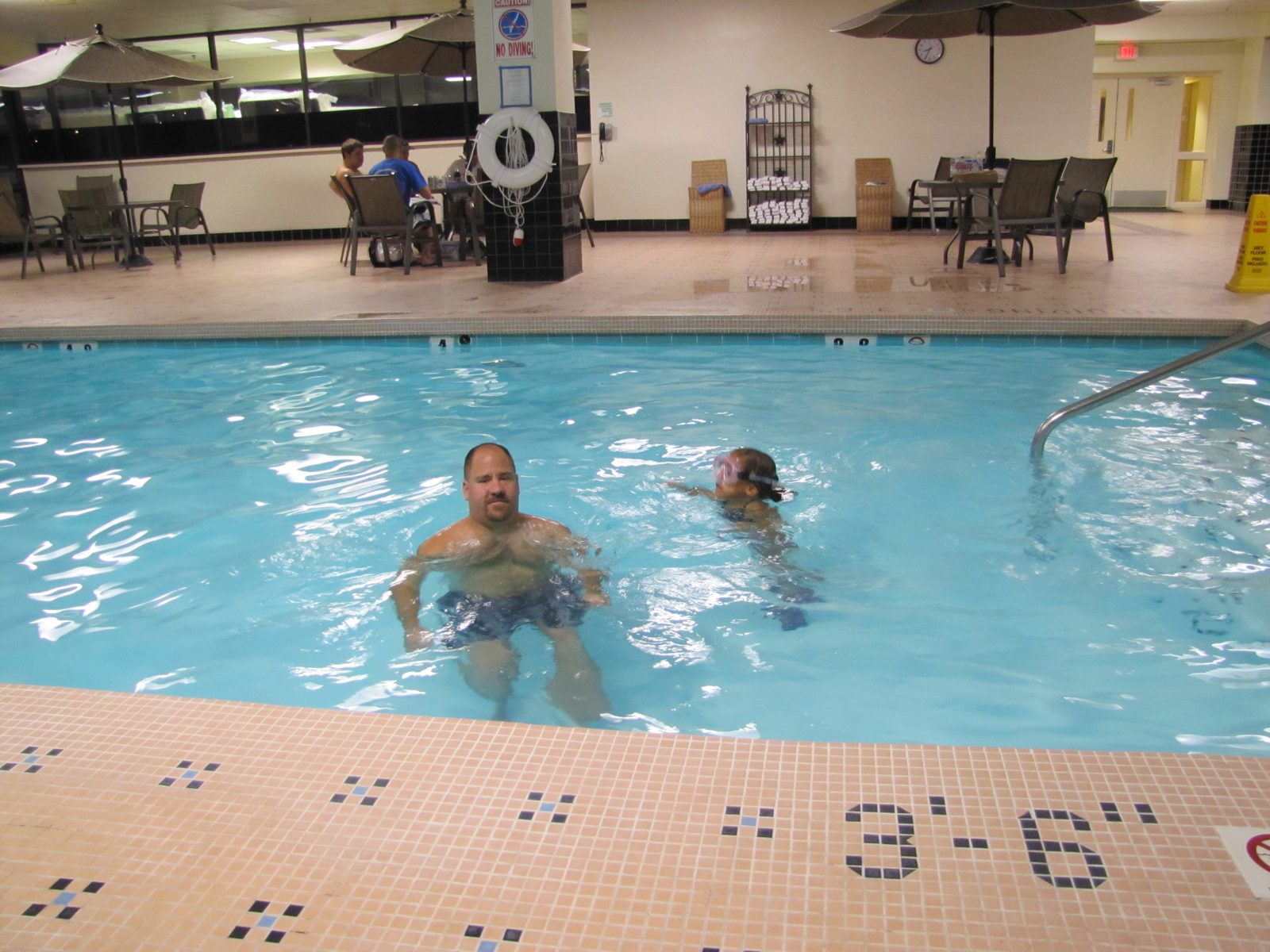 Lisa and Michael swimming in the hotel pool