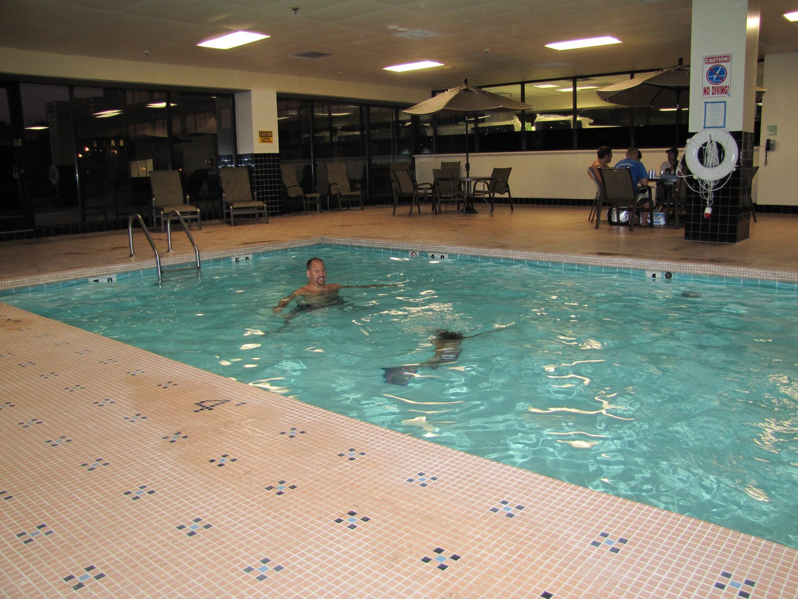 Swimming together at the hotel pool