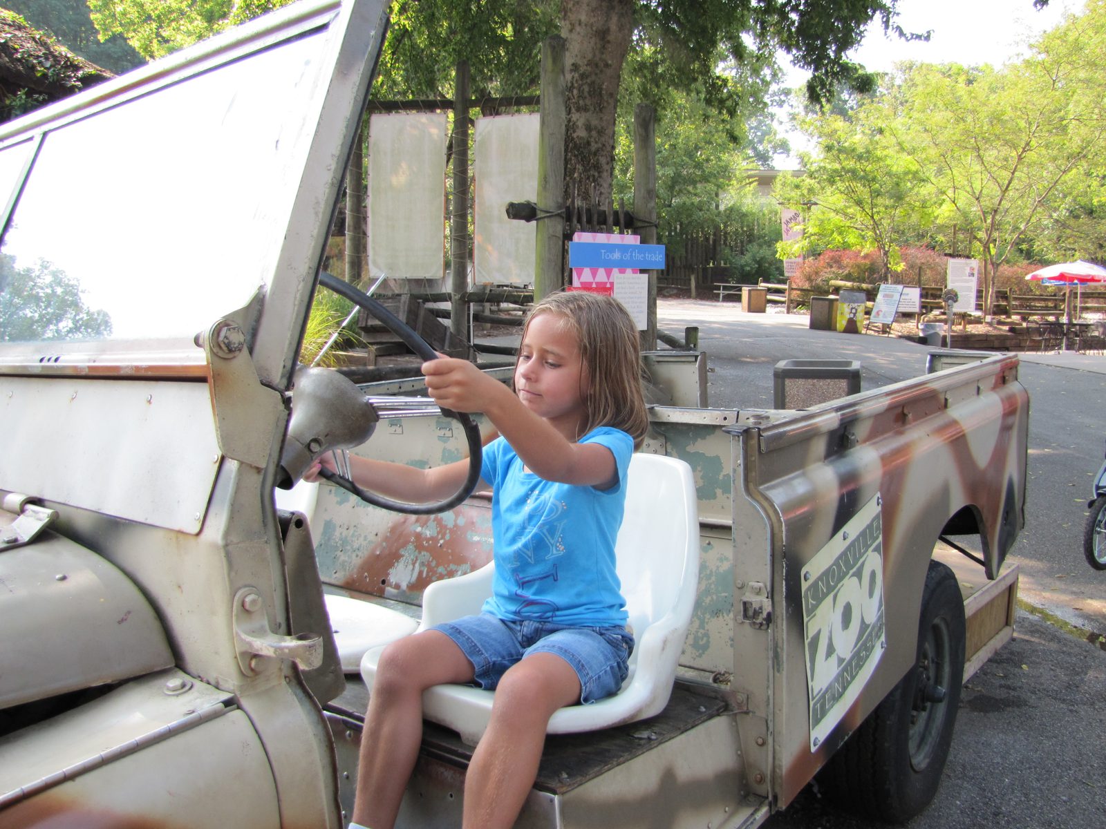 Lisa driving the kids' safari jeep