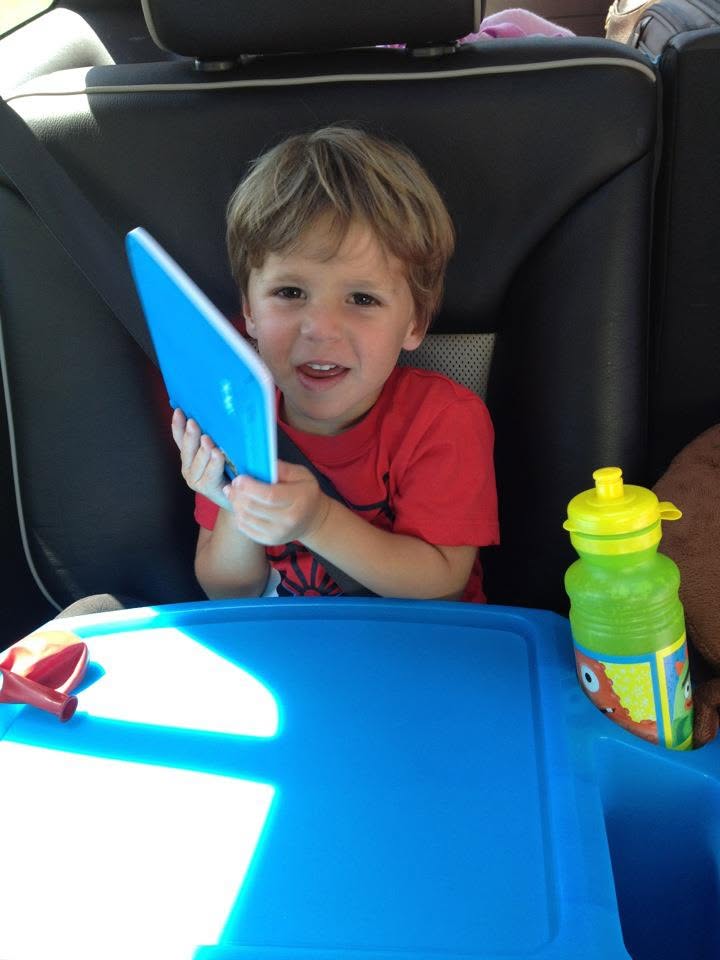 Thomas with his tablet in the car, ready to roll