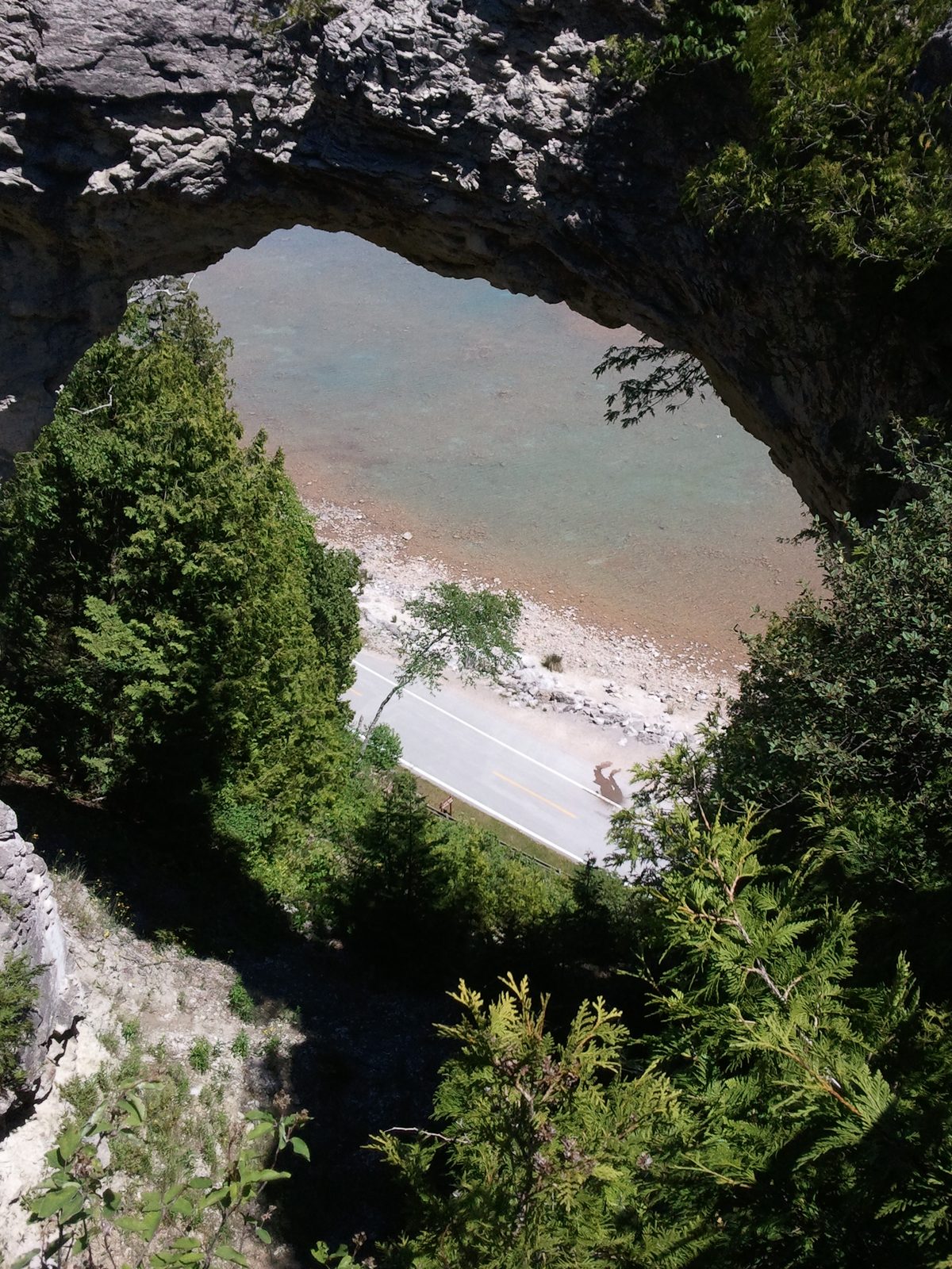 Looking down through Arch Rock to the beach