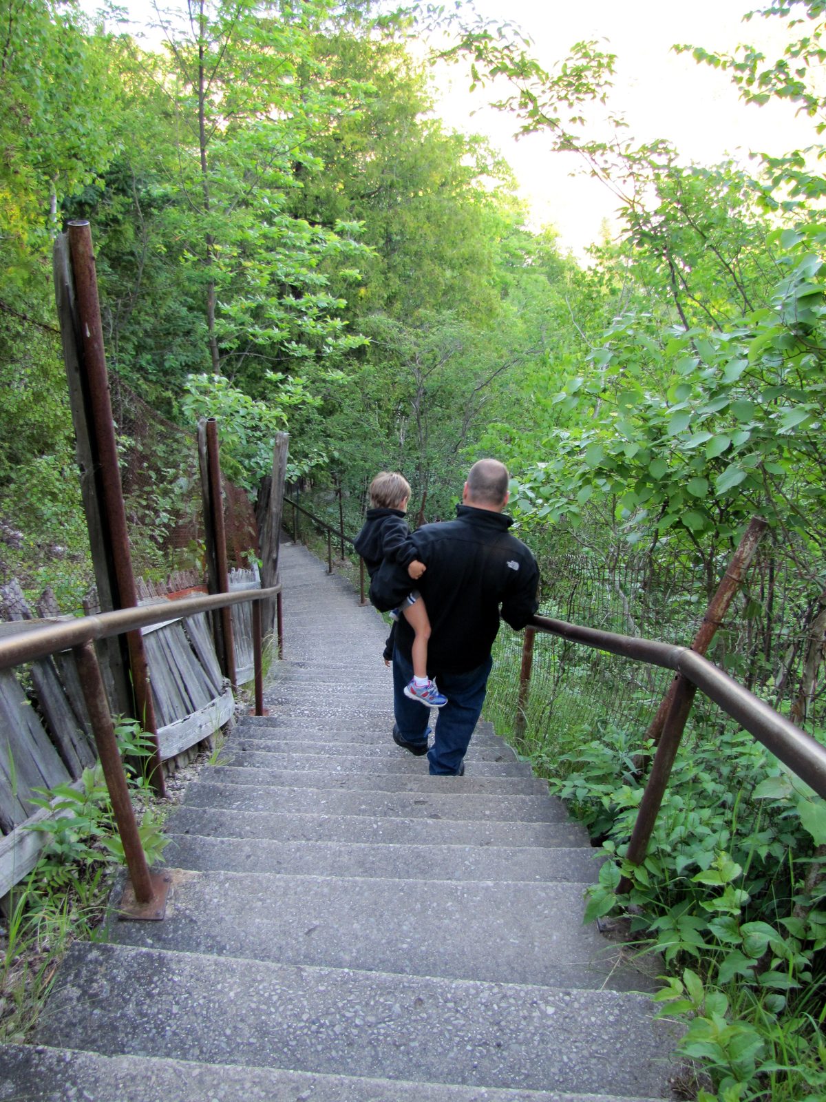 Michael carrying Thomas down the steps at Castle Rock