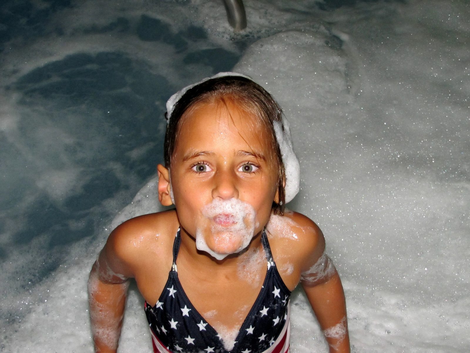 Lisa covered in bubbles in the hot tub
