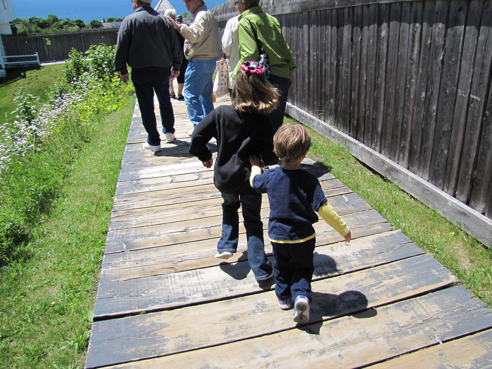 The kids on the boardwalk at Fort Mackinac